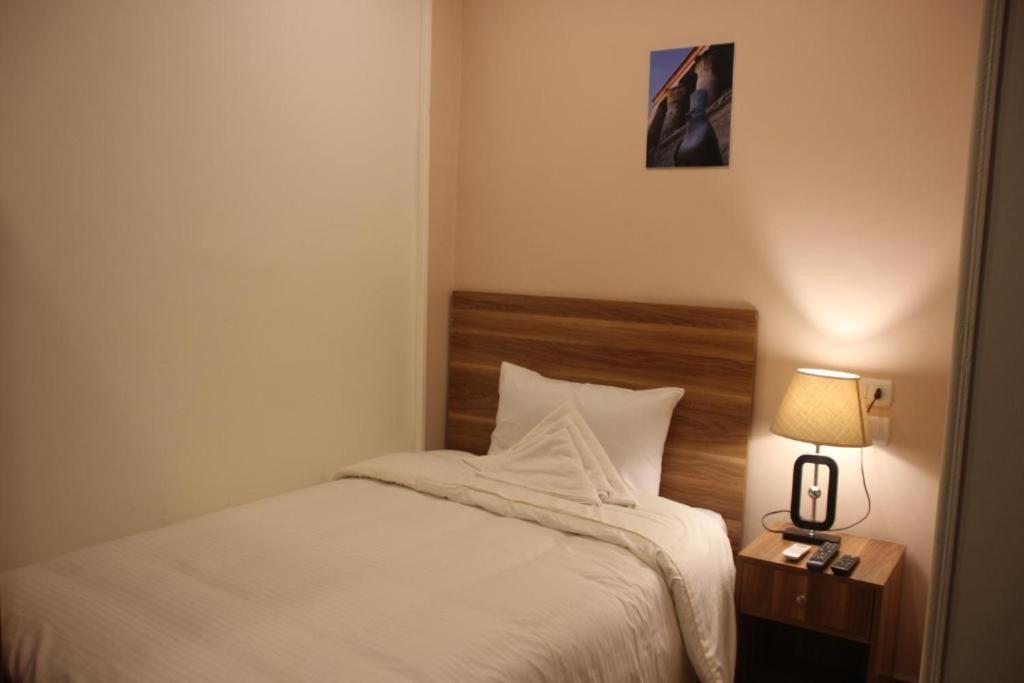 Postel nebo postele na pokoji v ubytování Mystic - Pyramids Inn