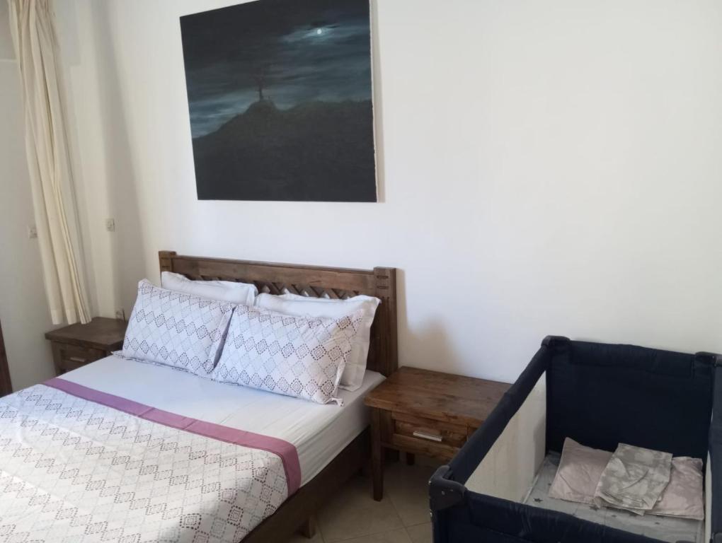 Postel nebo postele na pokoji v ubytování Grand Appartement Martil