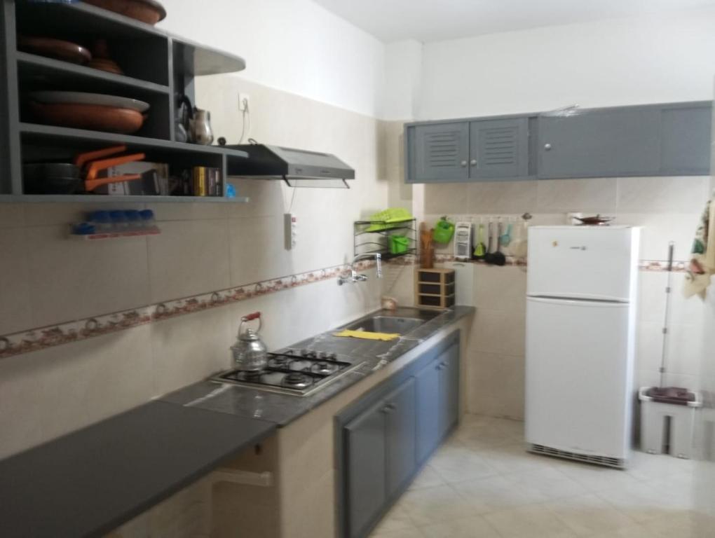 Kuchyň nebo kuchyňský kout v ubytování Grand Appartement Martil