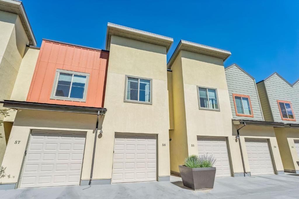 a row of houses with garages in front at Modern Townhouse with HotTub & Garage in Park City