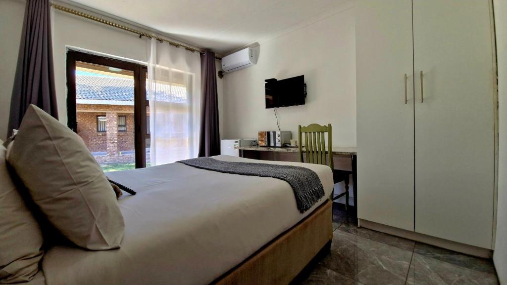 En eller flere senge i et værelse på 7 Heaven Boutique Hotel