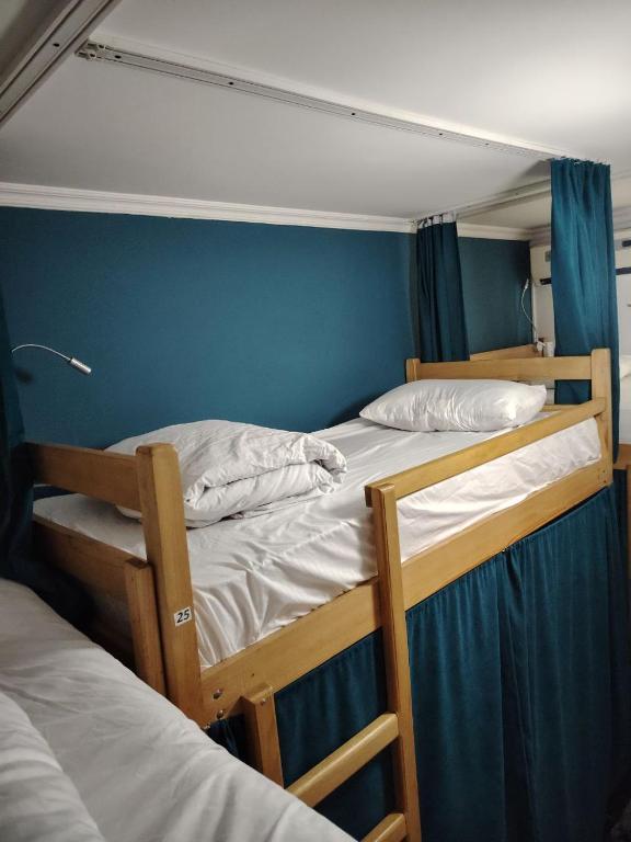 Voodi või voodid majutusasutuse Palm Guesthouse toas