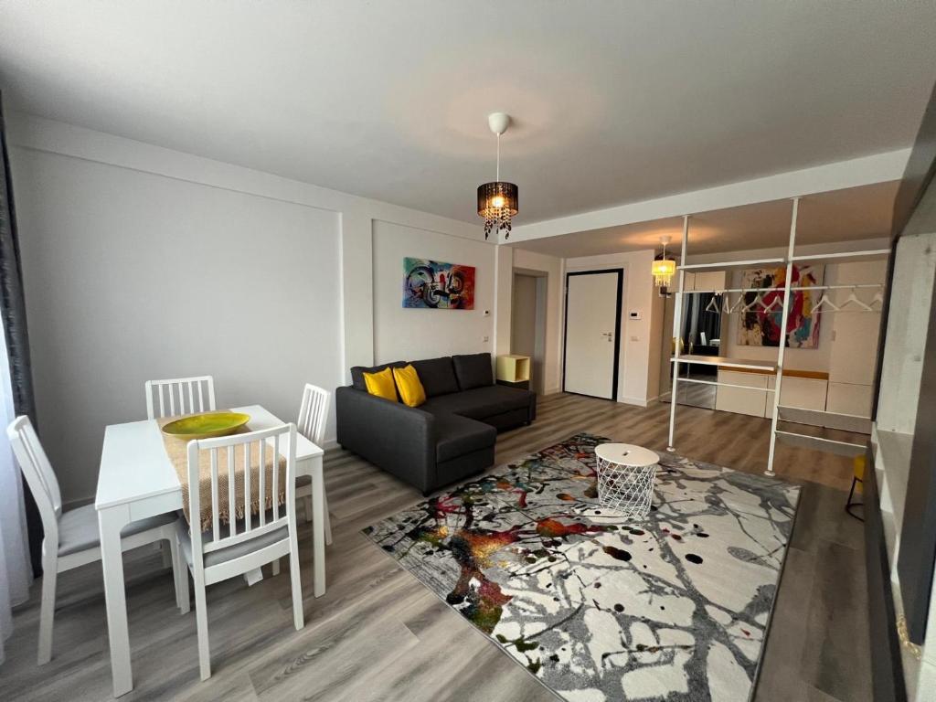 a living room with a couch and a table at Lapus Residence Apartament in Craiova