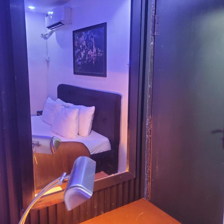 Postel nebo postele na pokoji v ubytování Weltons Apartments