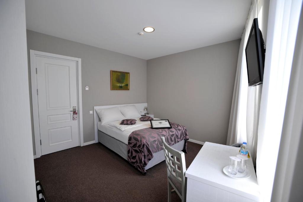 Postel nebo postele na pokoji v ubytování Hotel ZP Palace
