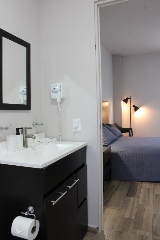 Postel nebo postele na pokoji v ubytování Lofts Las Fuentes