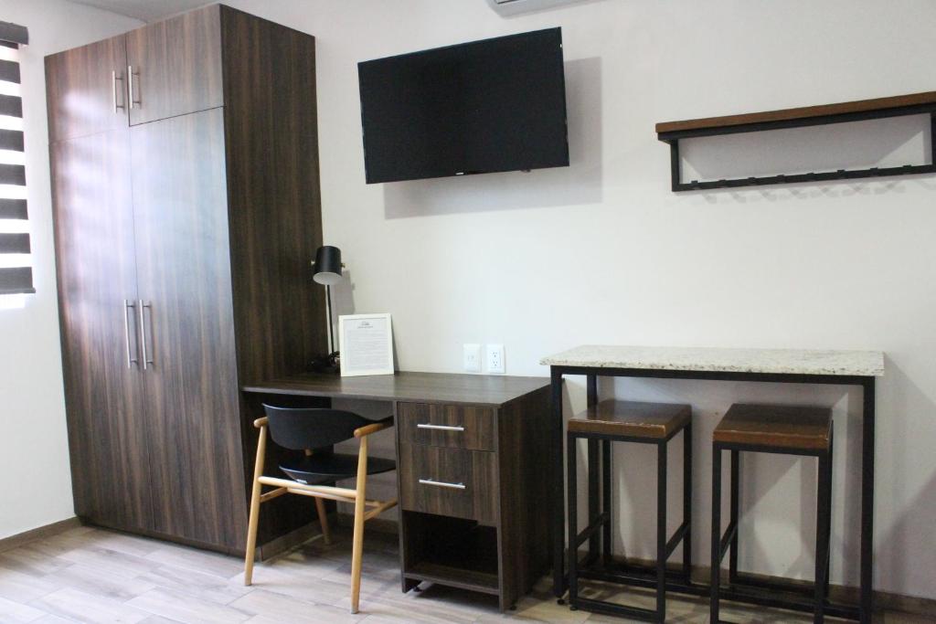 TV a/nebo společenská místnost v ubytování Lofts Las Fuentes