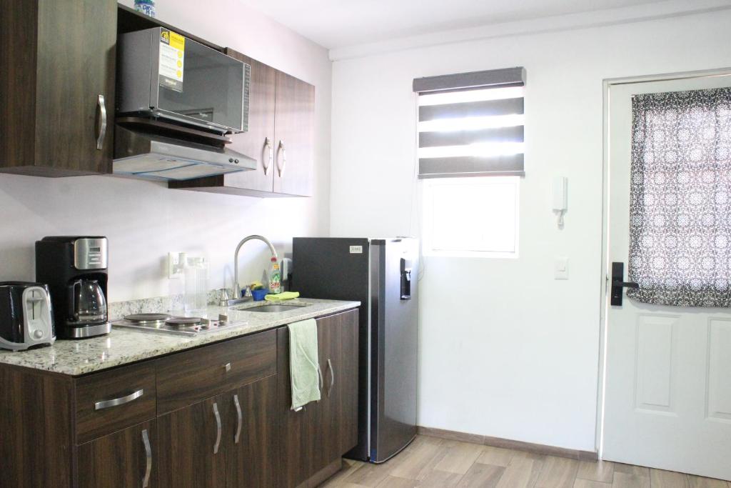 Kuchyň nebo kuchyňský kout v ubytování Lofts Las Fuentes