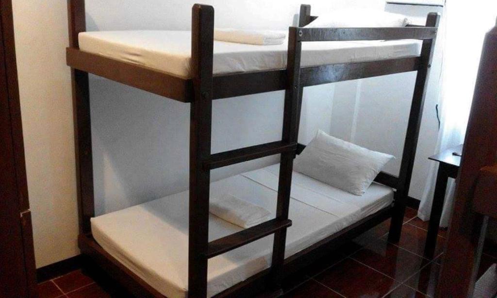 Postel nebo postele na pokoji v ubytování Ricardo Valley Inn