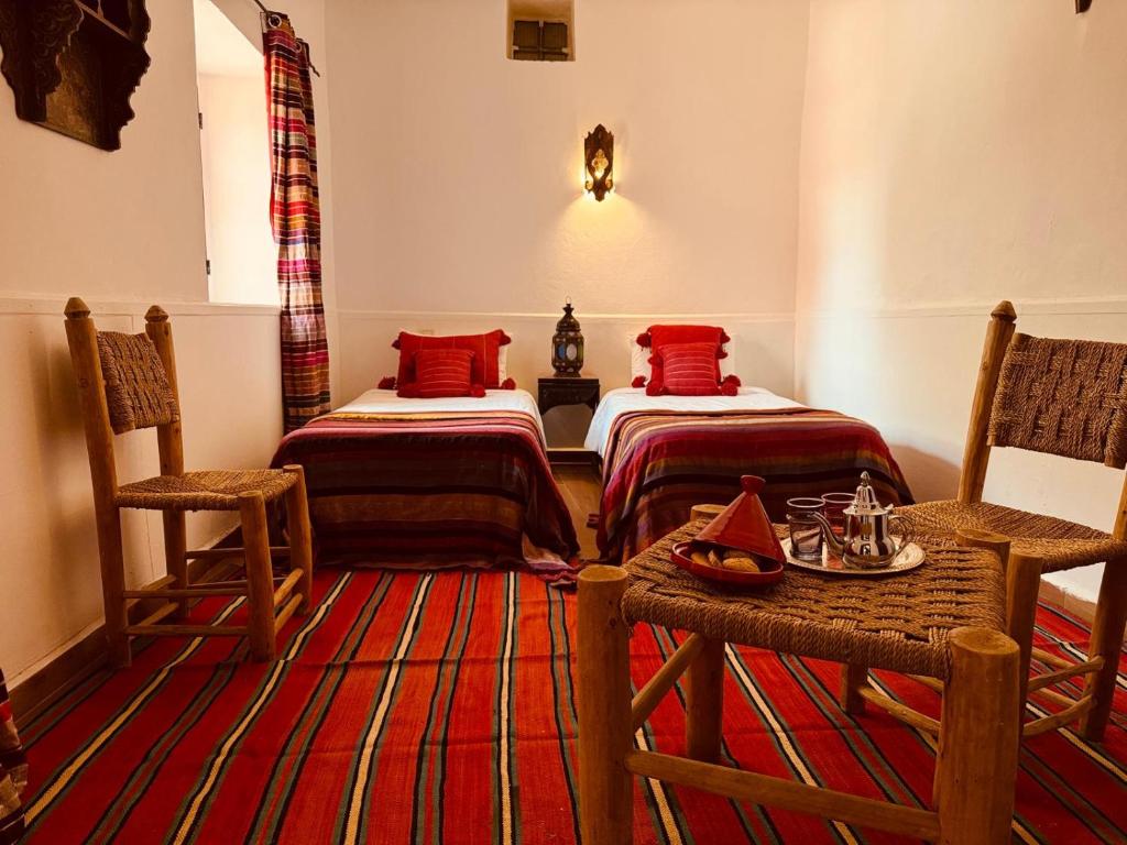 Postel nebo postele na pokoji v ubytování Riad Eucalyptus, Ethnic Hotel