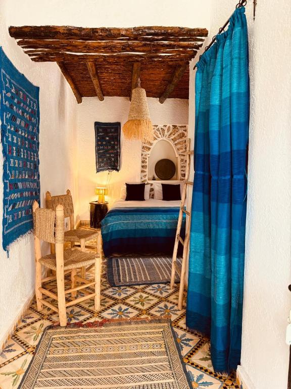 Postel nebo postele na pokoji v ubytování Riad Eucalyptus, Ethnic Hotel