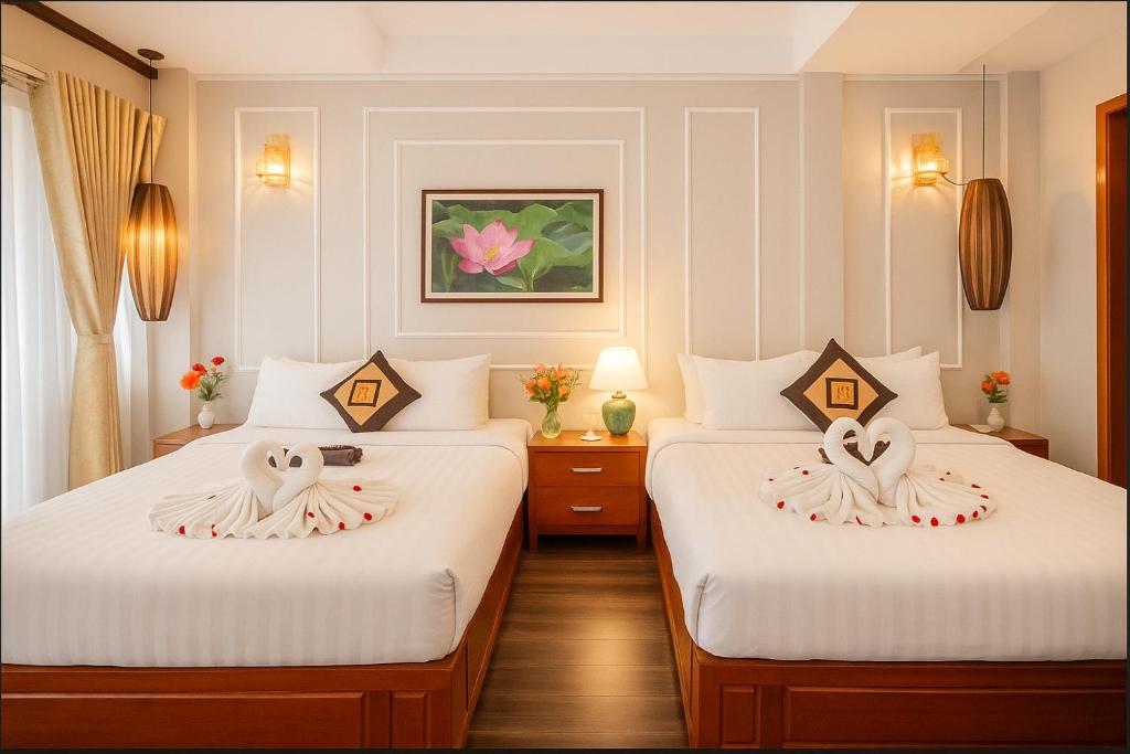 Postel nebo postele na pokoji v ubytování Hanoi Sena Hotel & Travel - Former Symphony Hanoi Hotel