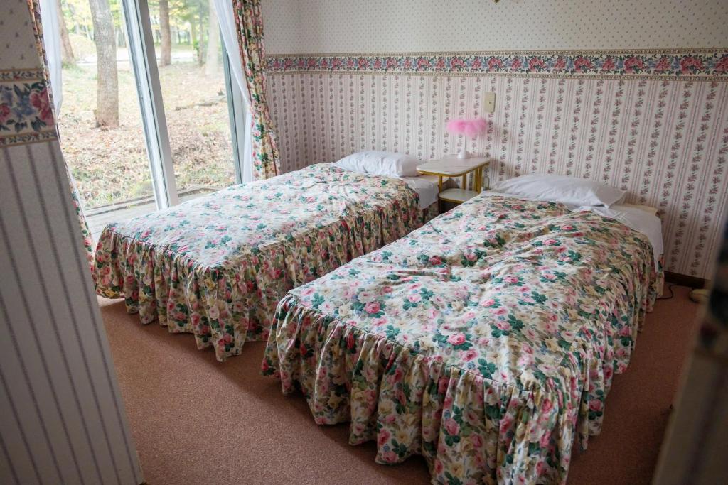 Postel nebo postele na pokoji v ubytování Pension Balmy