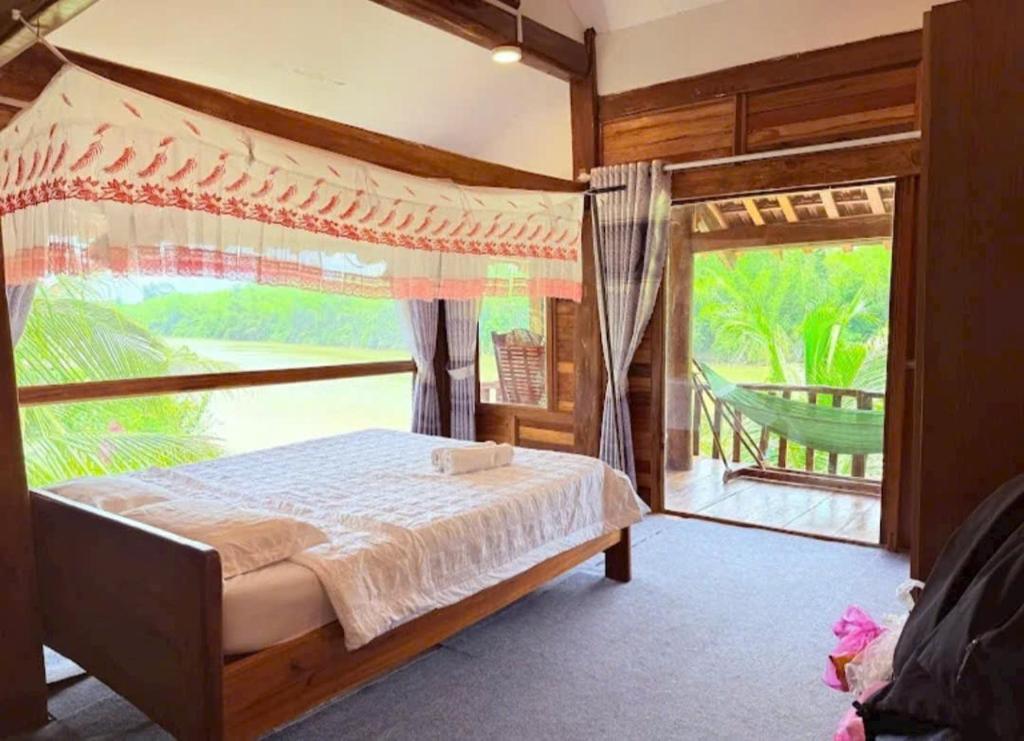 Postel nebo postele na pokoji v ubytování Green Bamboo Lodge Resort