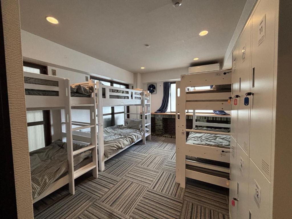 Postel nebo postele na pokoji v ubytování ゲストハウス ブランク Guest House BLANC