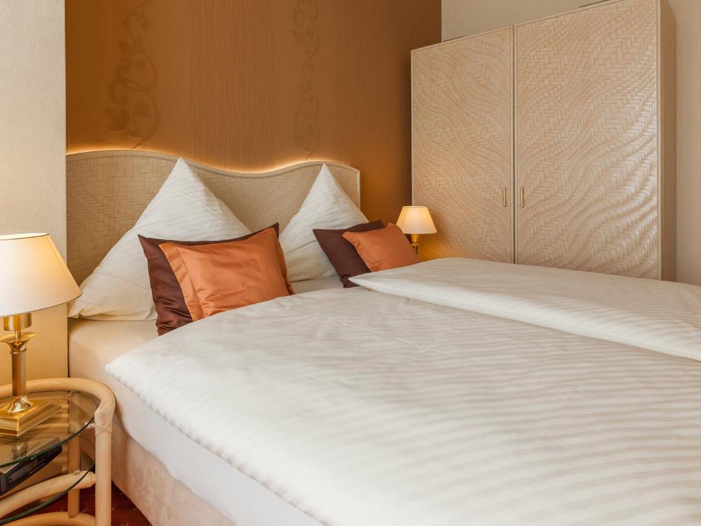 Postel nebo postele na pokoji v ubytování Park-Hotel