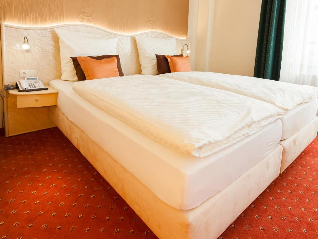 Postel nebo postele na pokoji v ubytování Park-Hotel