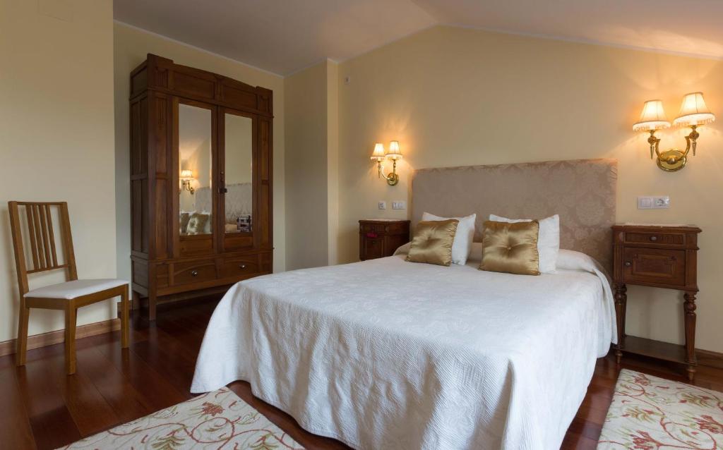 Cama o camas de una habitación en La Casona de la Roza