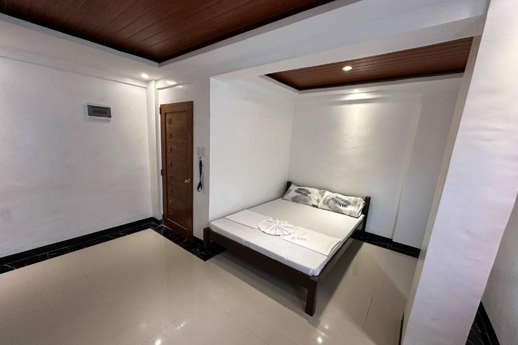 Postel nebo postele na pokoji v ubytování White-Beach Hideaway Resort Puerto Galera