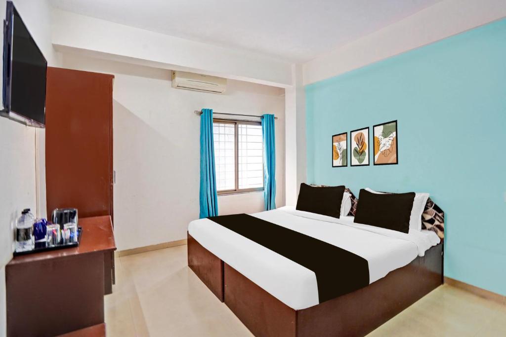Postel nebo postele na pokoji v ubytování Hotel O Rane Nagar formerly Shree Mangal Complex