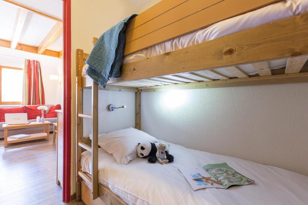 Кровать или кровати в номере Résidence Pierre & Vacances Les Ravines