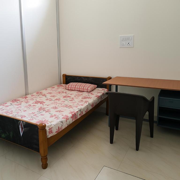 Postel nebo postele na pokoji v ubytování Keshari Stay Inn