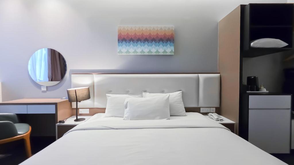 Postel nebo postele na pokoji v ubytování Fives Hotel DNP