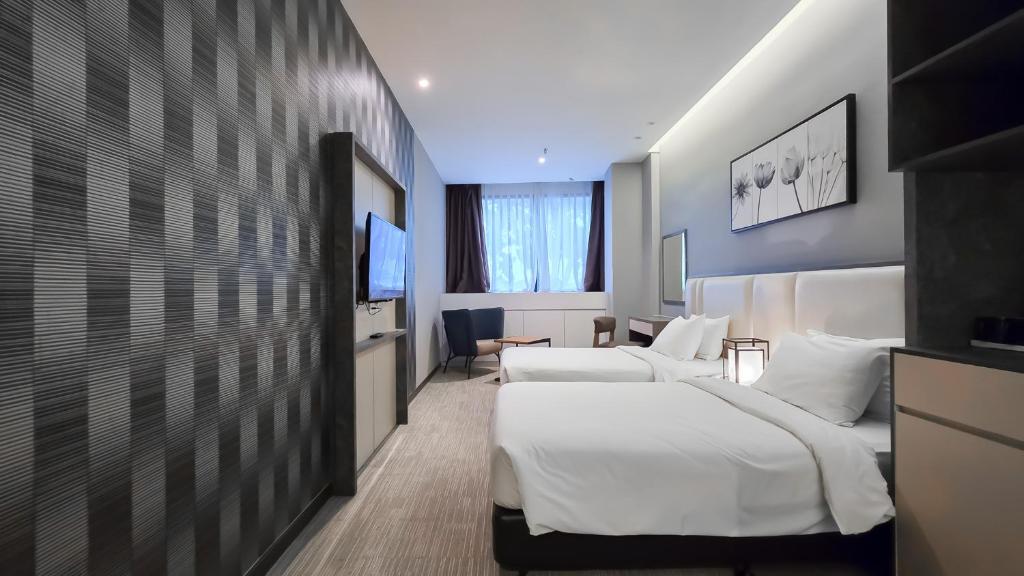 Postel nebo postele na pokoji v ubytování Fives Hotel DNP