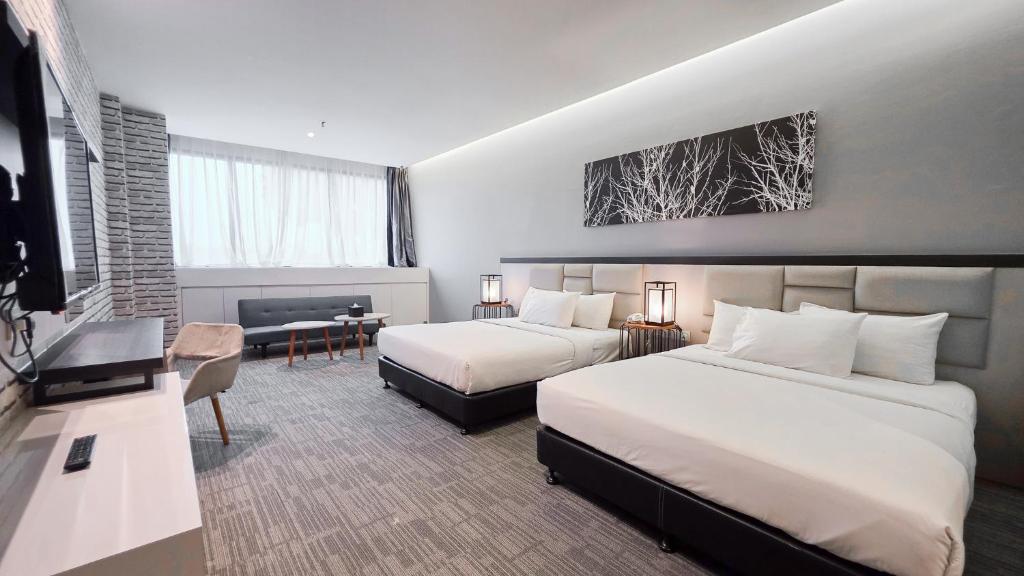 Postel nebo postele na pokoji v ubytování Fives Hotel DNP