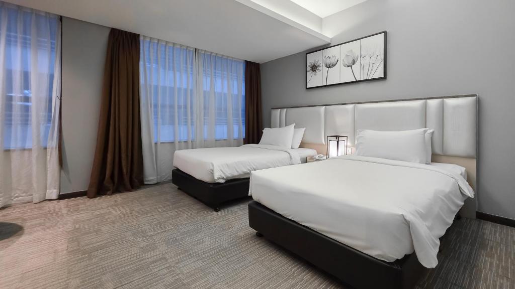 Postel nebo postele na pokoji v ubytování Fives Hotel DNP