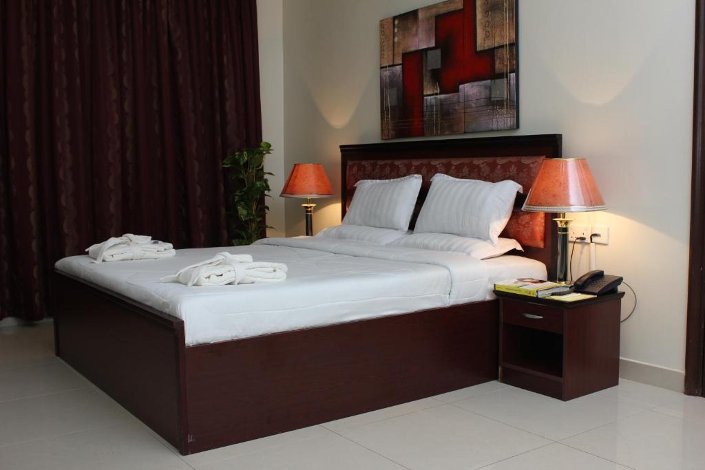 Krevet ili kreveti u jedinici u okviru objekta Reem Hotel Apartments