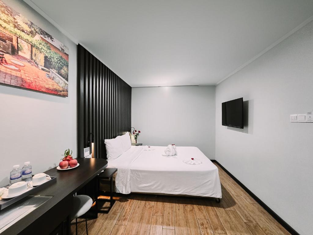 Giường trong phòng chung tại Hermes Hotel Nha Trang