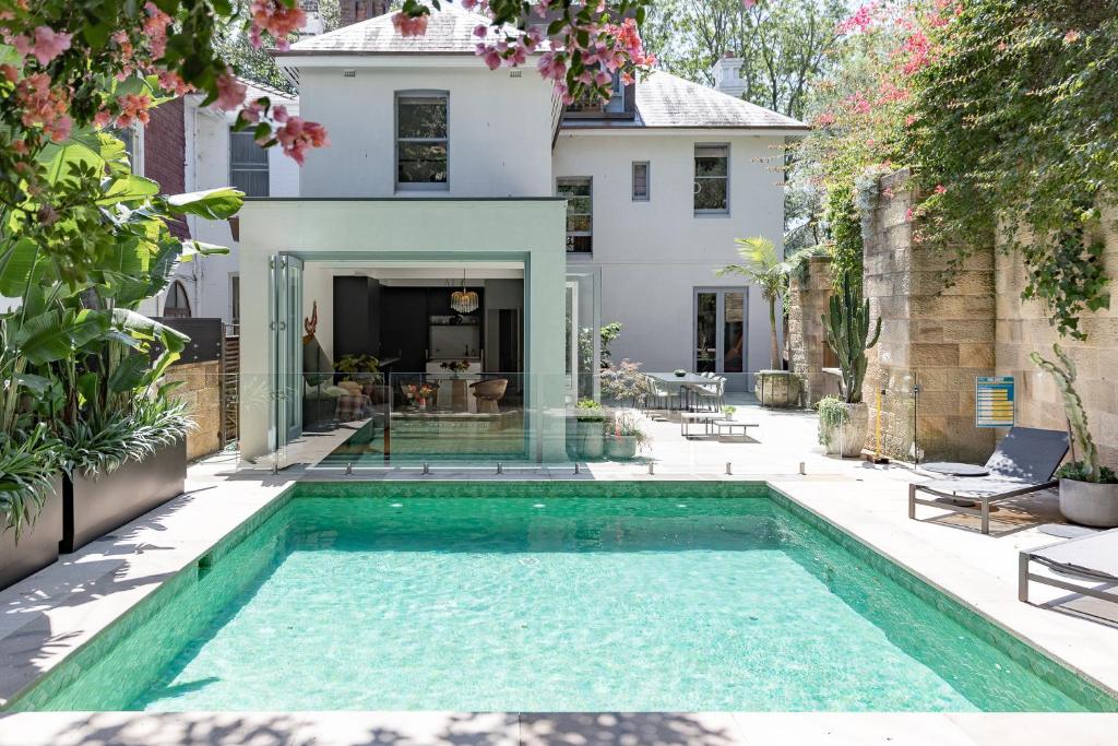a swimming pool in the backyard of a house at The Darling Private Oasis with Heated Magnesium Pool in Sydney