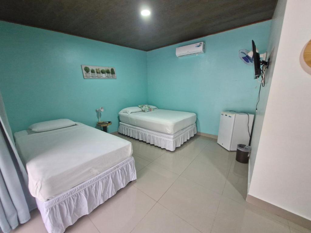 Postel nebo postele na pokoji v ubytování Hotel Carlota Tamarindo