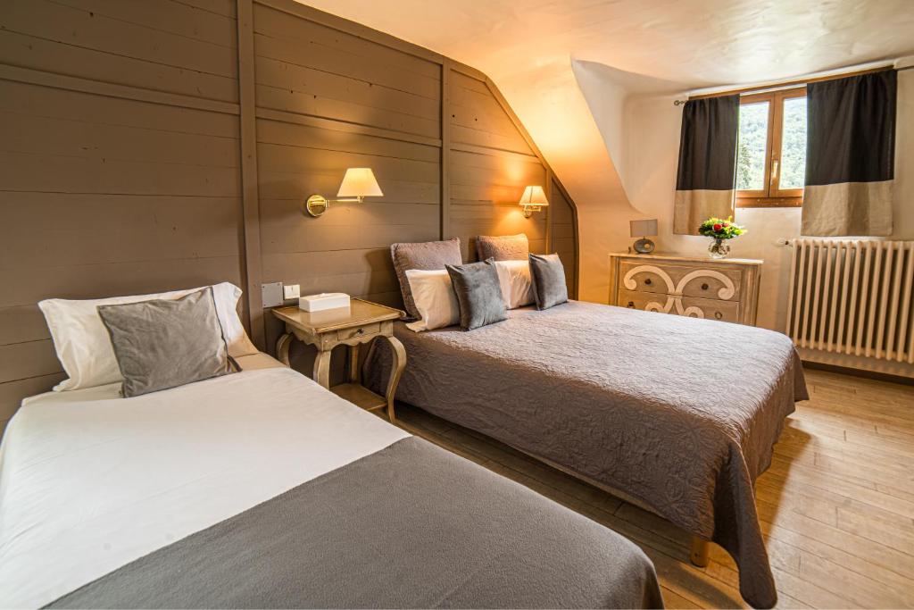 Postel nebo postele na pokoji v ubytování Hôtel Le Belvédère
