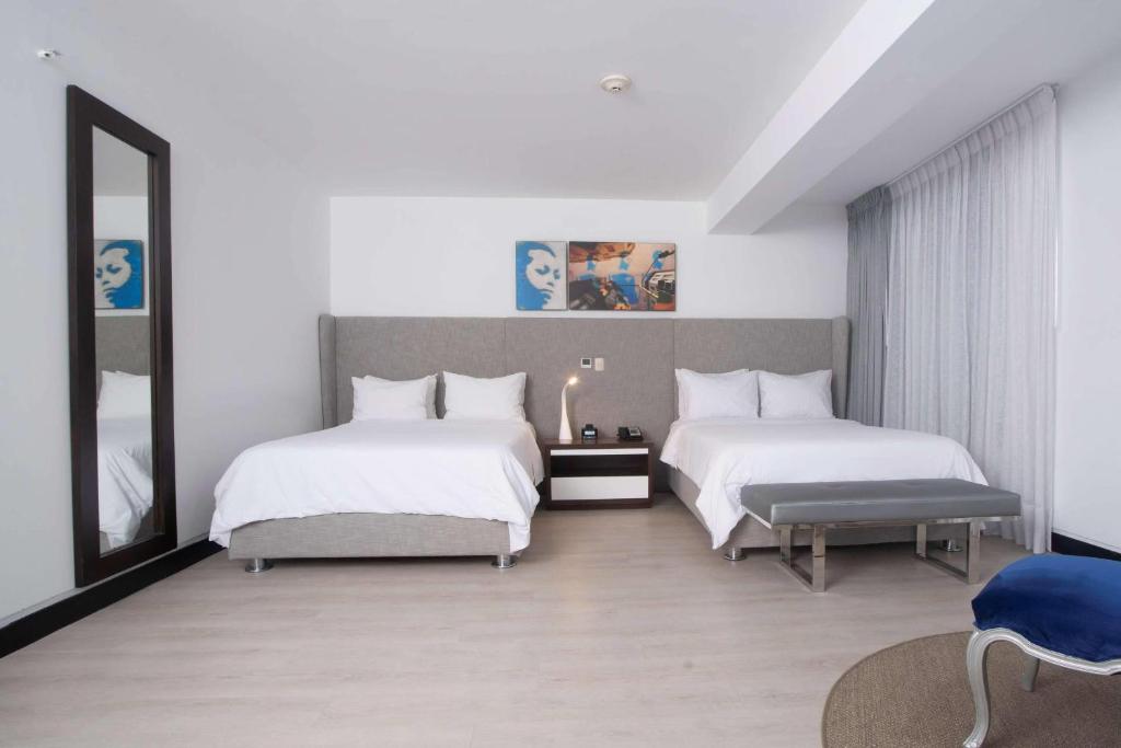 Letto o letti in una camera di Radisson Hotel Decapolis Miraflores