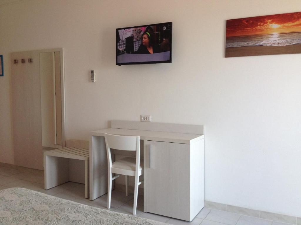 TV a/nebo společenská místnost v ubytování Hotel Strand