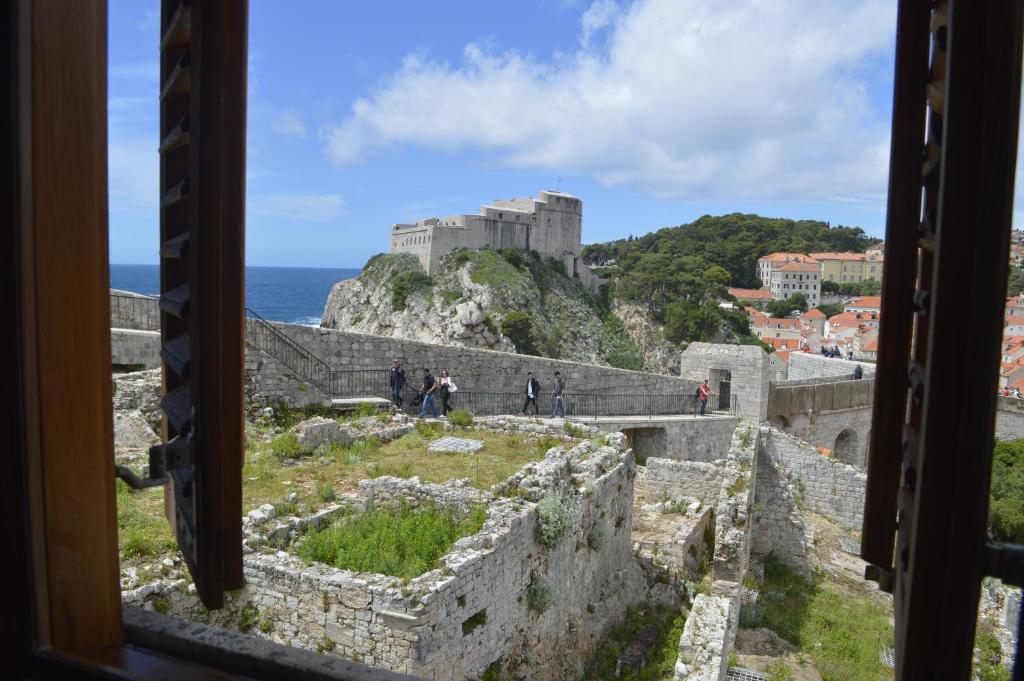 a view from a window of a castle at Dubrovnik Rupe Apartment in Dubrovnik