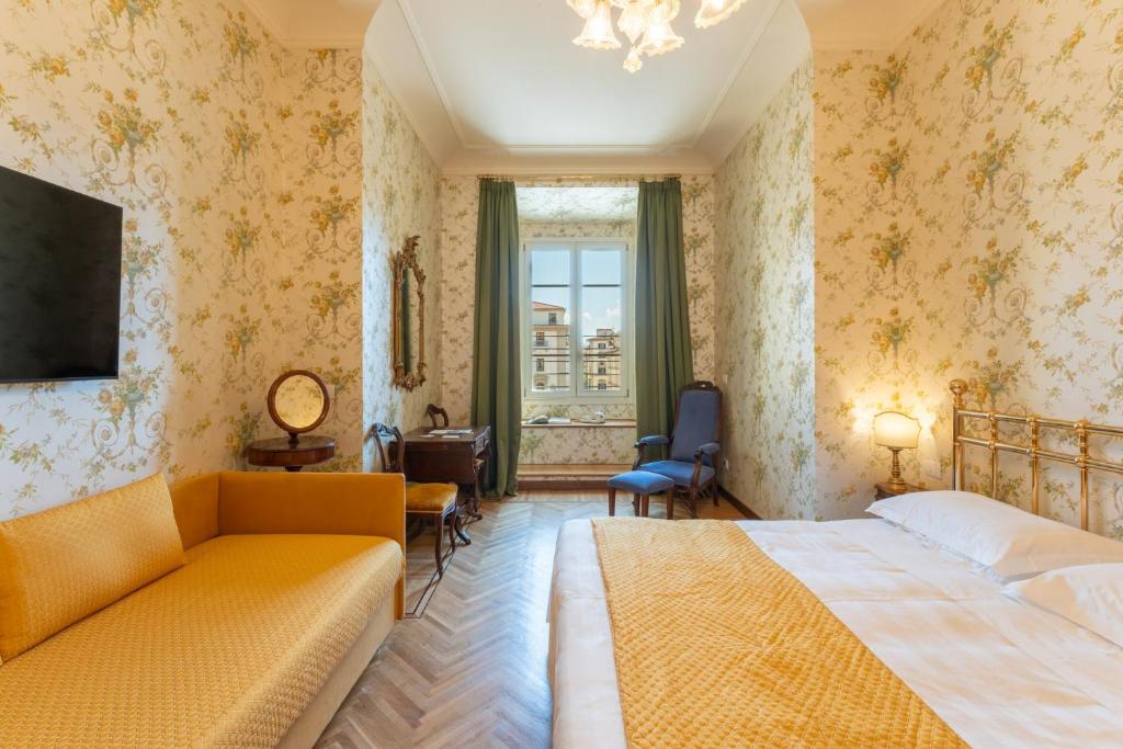 Postel nebo postele na pokoji v ubytování Hotel Pendini