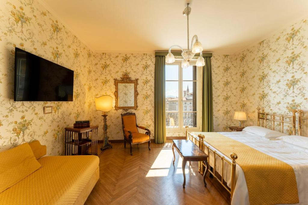 Postel nebo postele na pokoji v ubytování Hotel Pendini