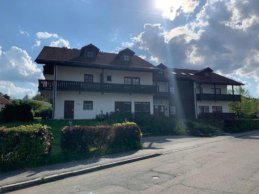 a large white house on the side of a road at Apartment 55 Mezonet in Zwiesel