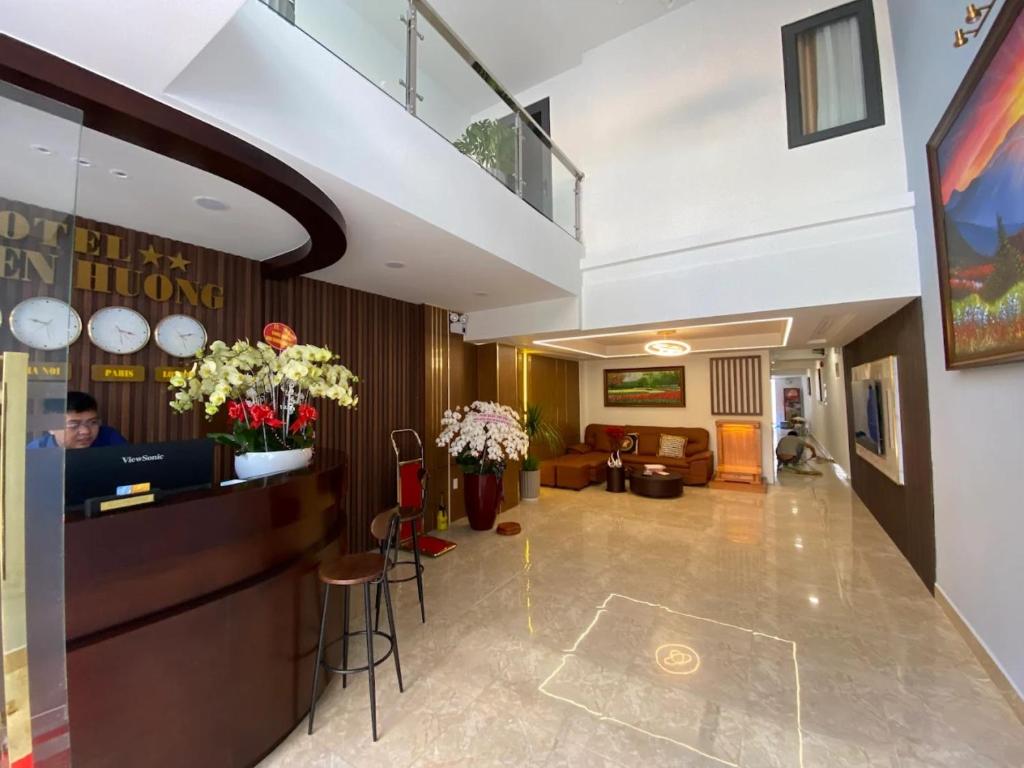 a lobby of a hotel with a reception desk at Nguyên Hương Hotel in Ho Chi Minh City