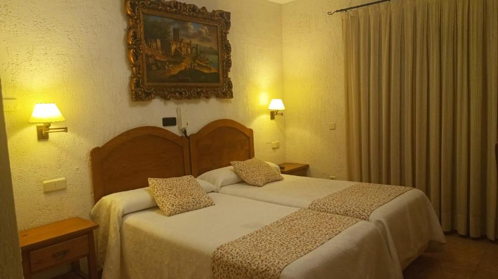 Postel nebo postele na pokoji v ubytování hostal Decerca Prádena