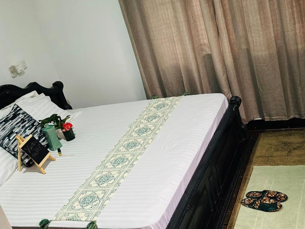 Ένα ή περισσότερα κρεβάτια σε δωμάτιο στο Orchid Cottages