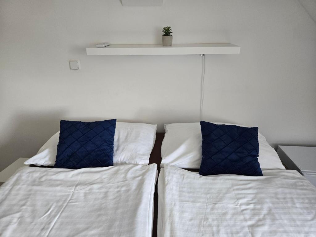 Postel nebo postele na pokoji v ubytování Hotel Restaurant Na Statku