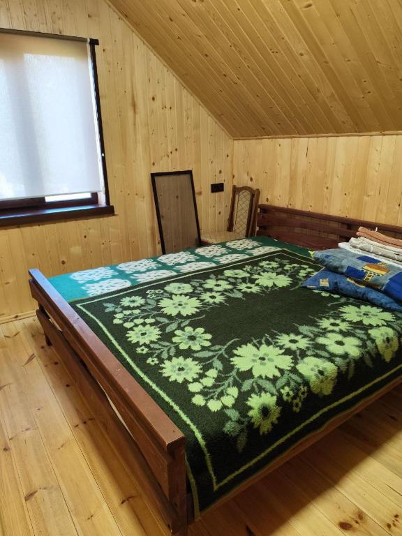 Postel nebo postele na pokoji v ubytování садиба ТУГАН-ДВІР