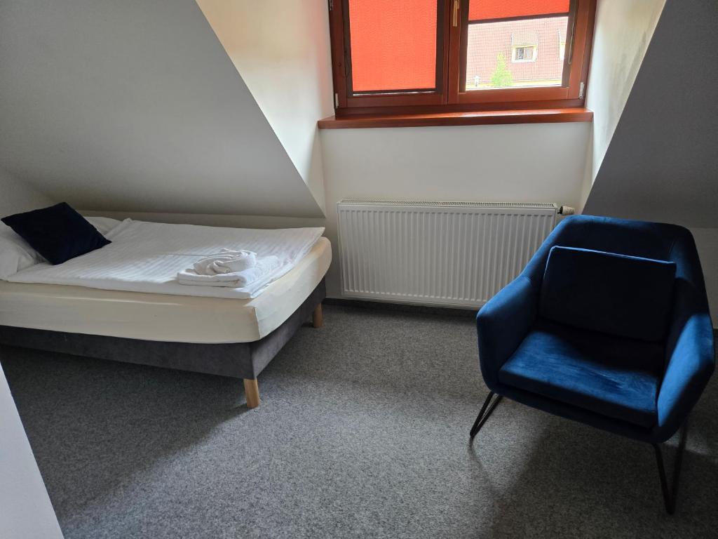 Postel nebo postele na pokoji v ubytování Hotel Restaurant Na Statku