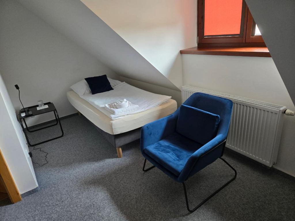 Postel nebo postele na pokoji v ubytování Hotel Restaurant Na Statku
