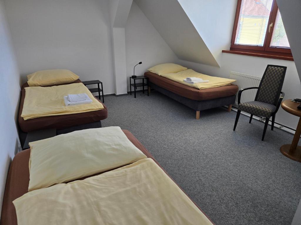 Postel nebo postele na pokoji v ubytování Hotel Restaurant Na Statku