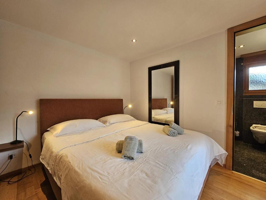 Postel nebo postele na pokoji v ubytování Aramis Lodge